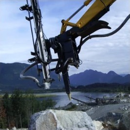 Excavator: Rock Drill Attachment